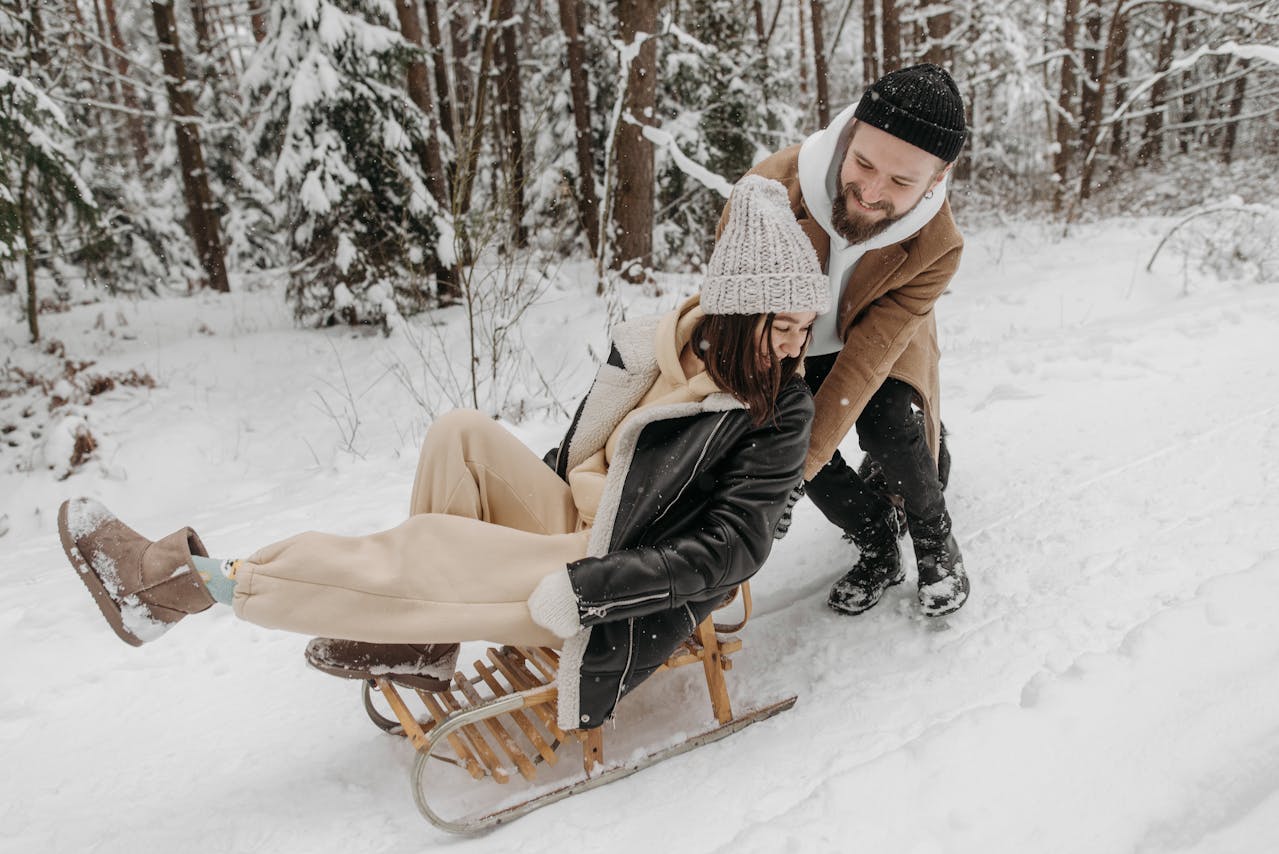 Winter Date Ideas Couple Sledding